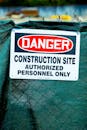 Close-up of a danger sign at a construction site indicating restricted access for authorized personnel only.